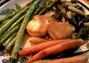 Sea scallops with roasted asparagus, roasted tri-colored carrots and steamed green chard. Fewer than 200 cals on that plate.