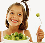 child smiling about brussels sprouts
